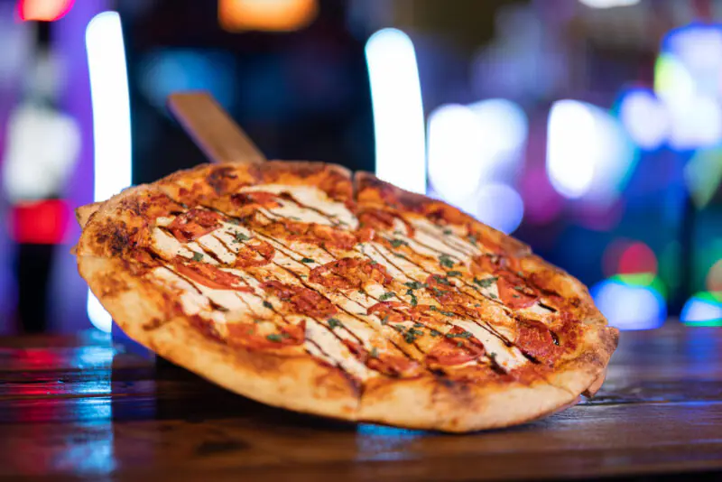 Pizza and dining area at Launch Brooklyn.