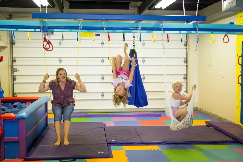 Children exploring movement and sensory equipment at Rylee's Play Place in Kalispell.