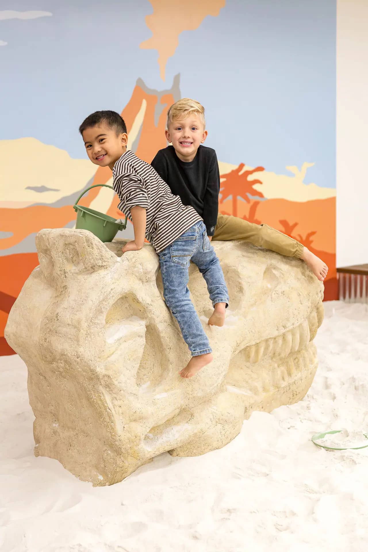Kids exploring themed play features at DiG PDX.