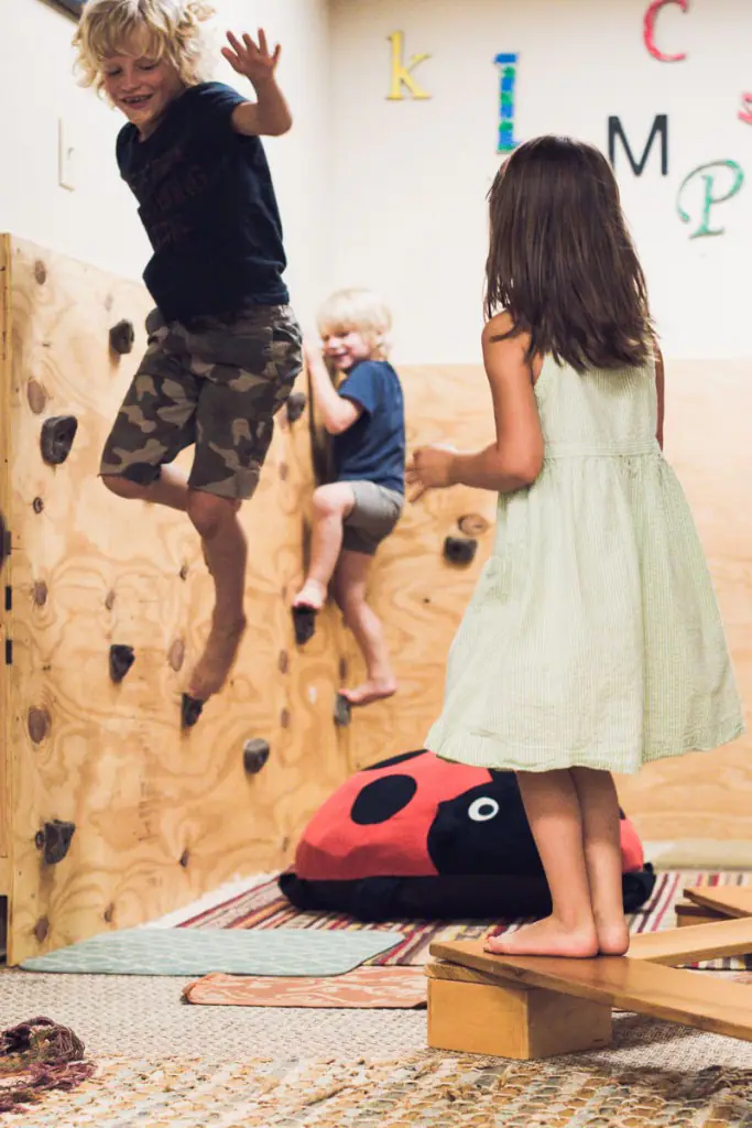 Child climbing inside the Lulu's Casita play space