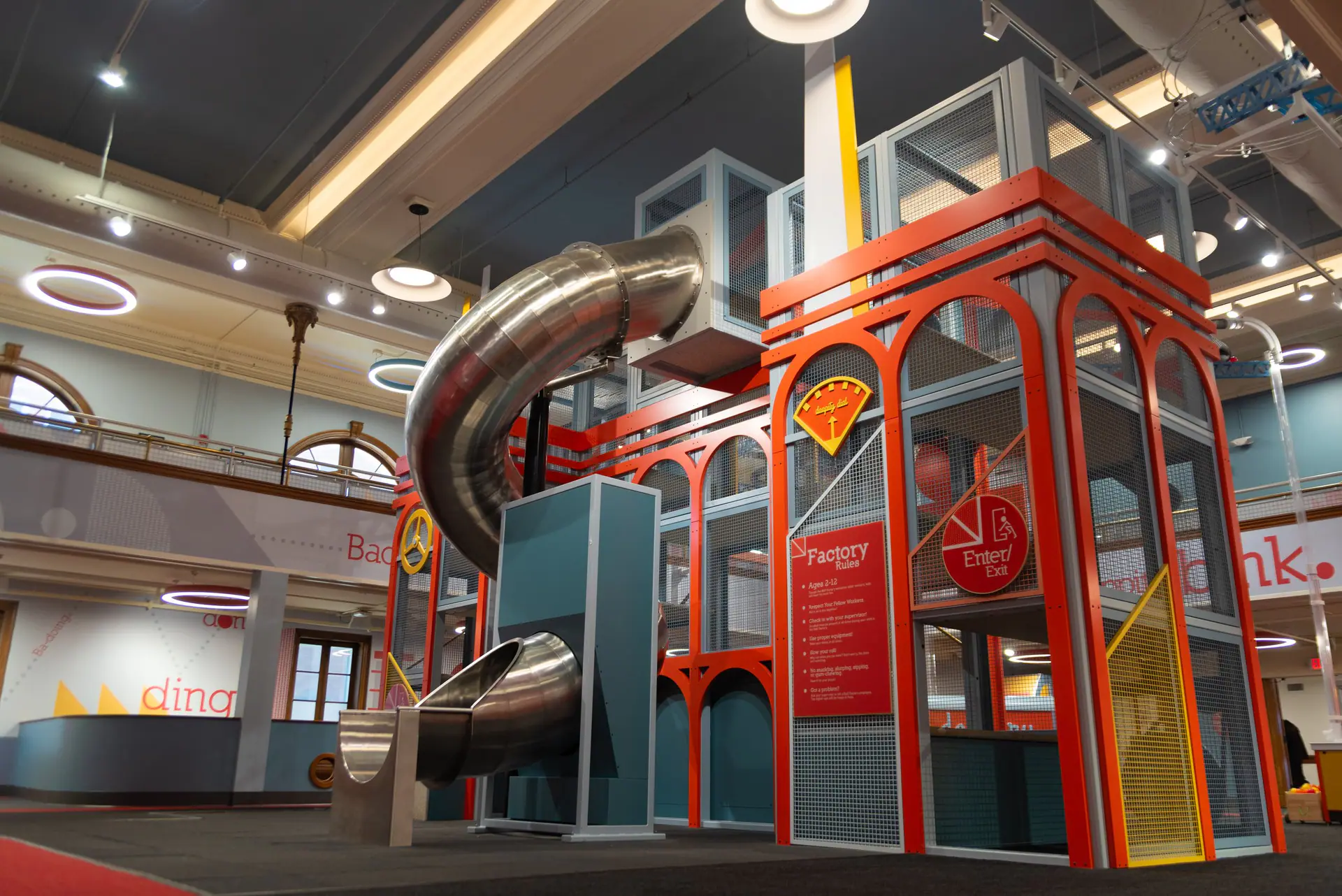 Colorful indoor slide and play features inside Discovery World on Market