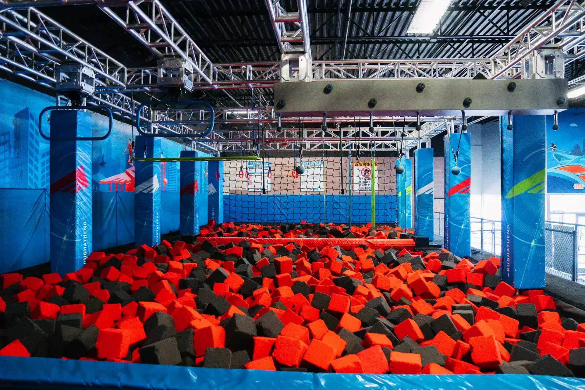 Foam pit and ninja-style obstacle area at Rush Athens.