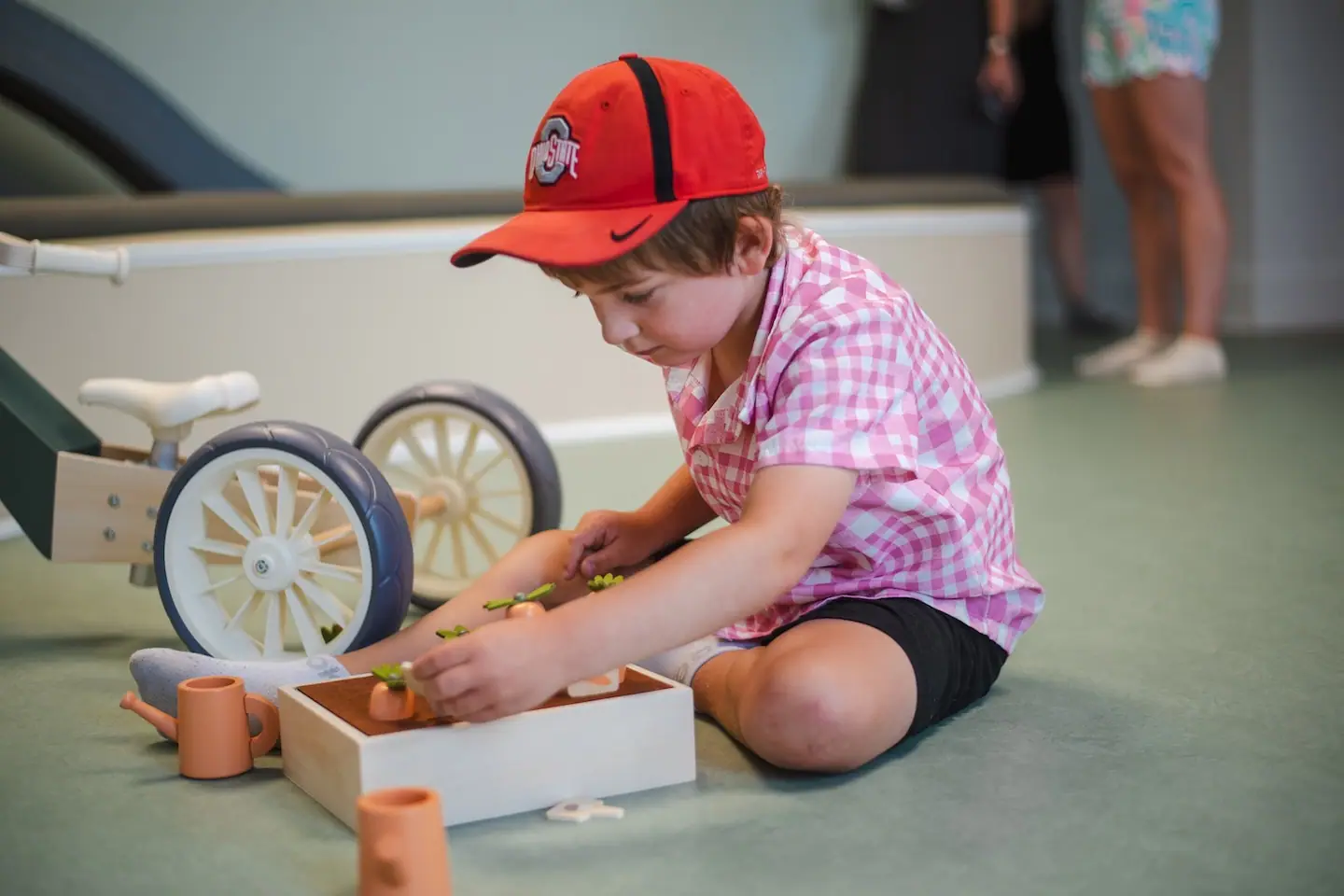 Child playing with tabletop toys at Little Town.