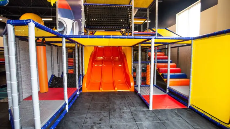 Wide view of the main PlaySpace climbing structure and slide.