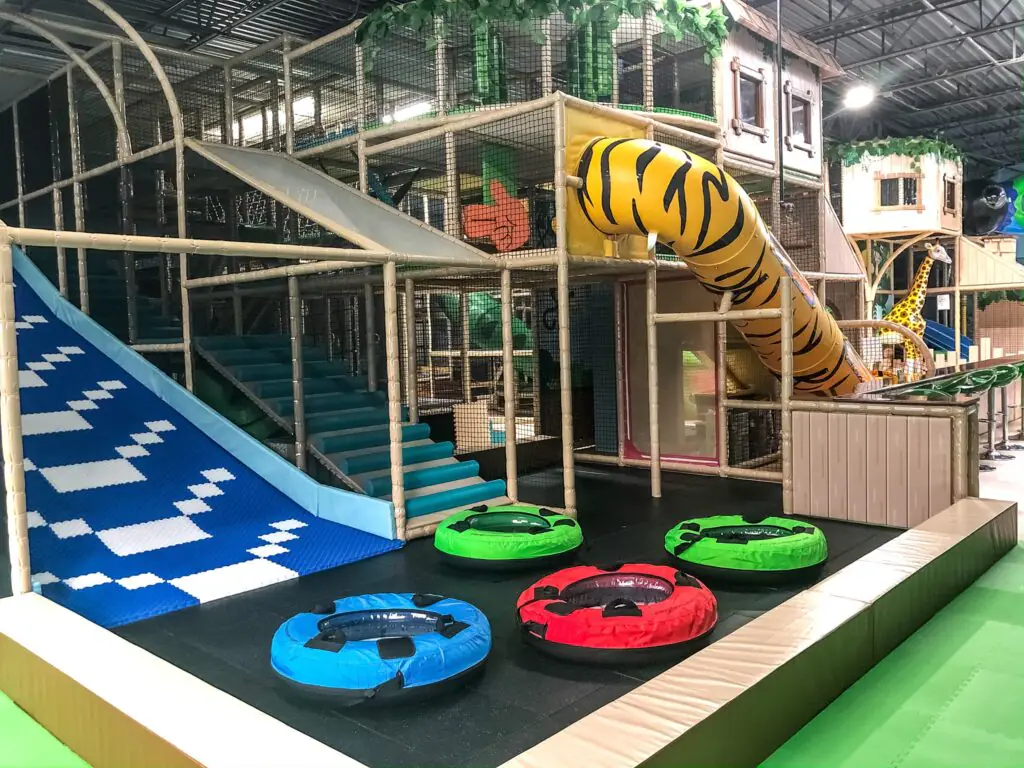 Children moving through tunnels and soft-play obstacles at Me Land - Frederick.
