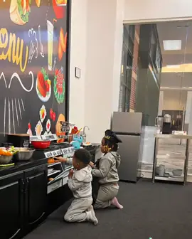 Children using the pretend kitchen setup at Imagining With Me