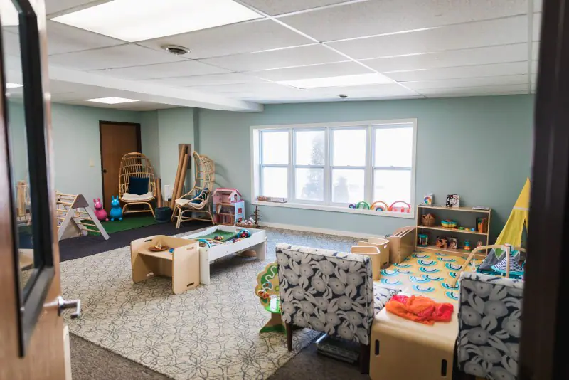 Open play room with curated toys at The Emerging Parent.