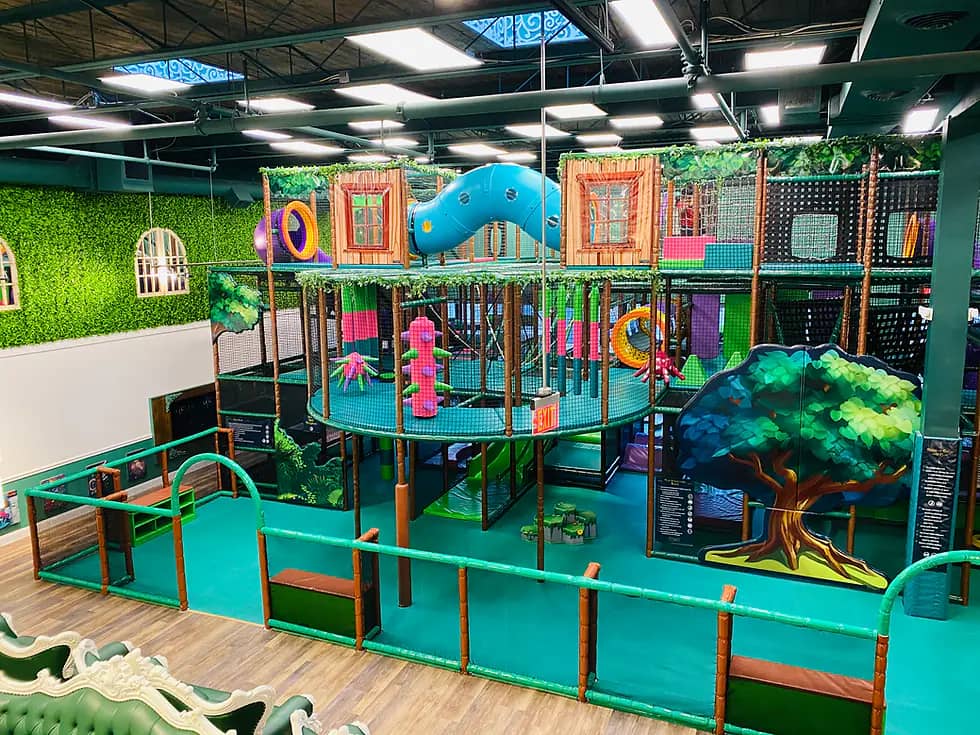 Play area seating and indoor playground space at Kidcadia Play Cafe.