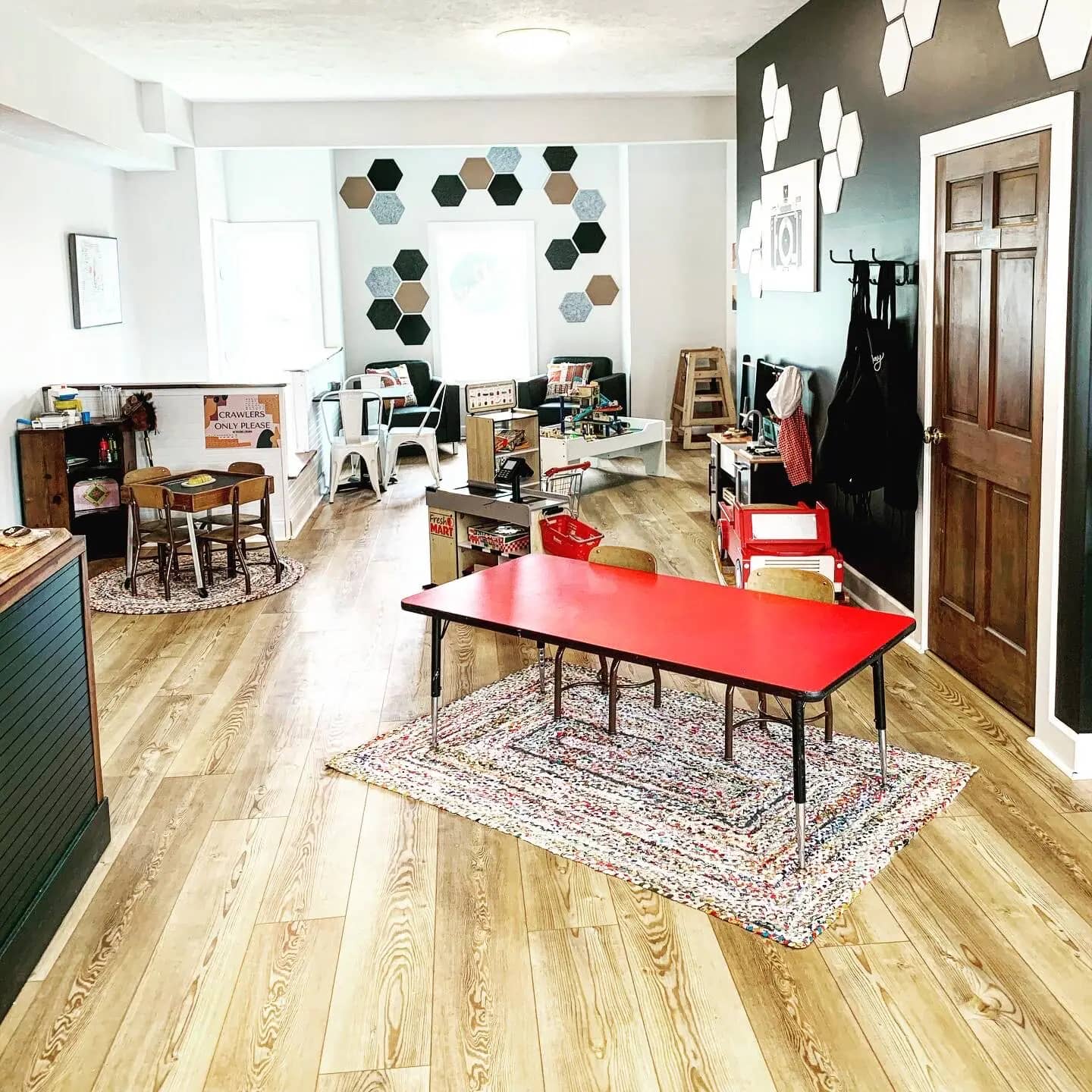 Indoor play area and caregiver seating at EverPlay Cafe in Grand Rapids.