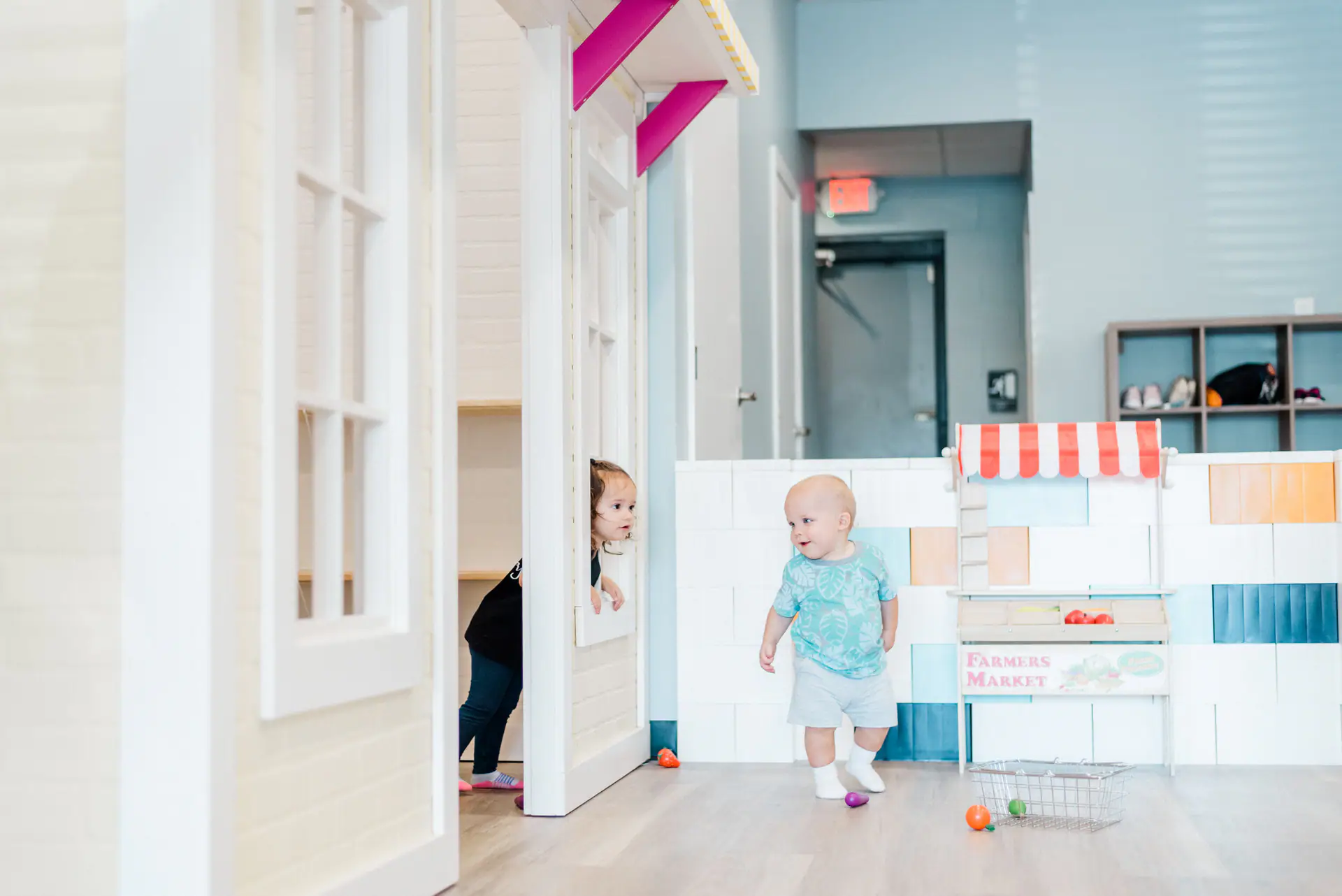 Children playing inside Play Factory and Cafe's littles-focused indoor space.
