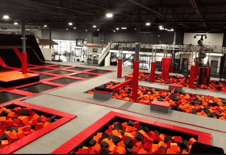 Trampoline and foam-pit area inside Lava Island Brookfield.