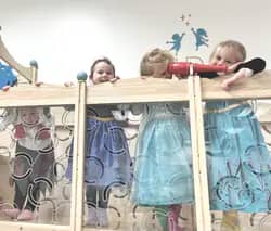 Children playing on the loft structure at Kidz Wishing Well