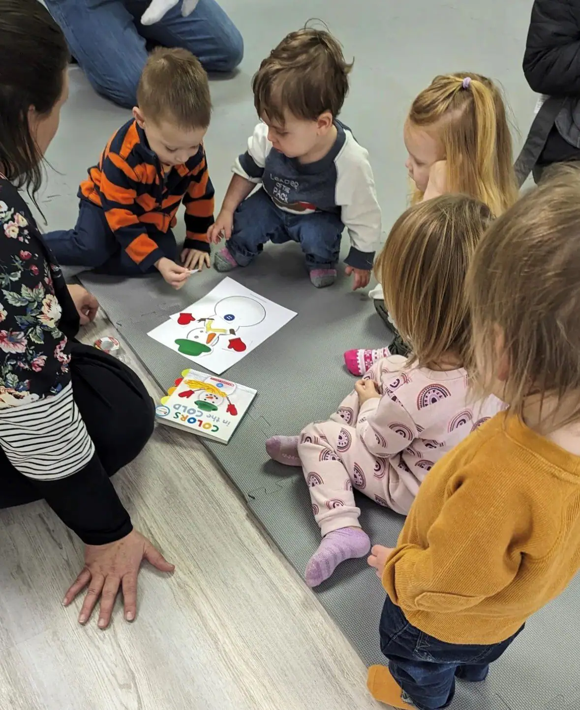 Caregiver-and-child activity at Little Hearts Playroom.