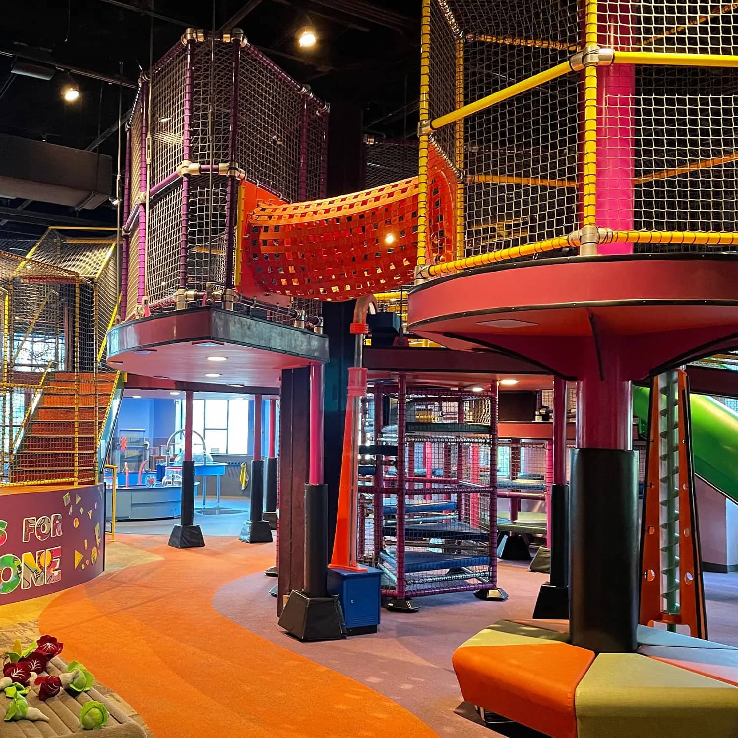 Colorful climbing structure inside McWane Science Center’s early-childhood exhibit.