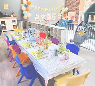 Birthday party table setup inside The Playroom in Morgantown.