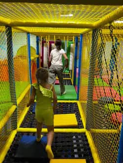 Indoor climbing and crawl structure at Little Sharks Playground.
