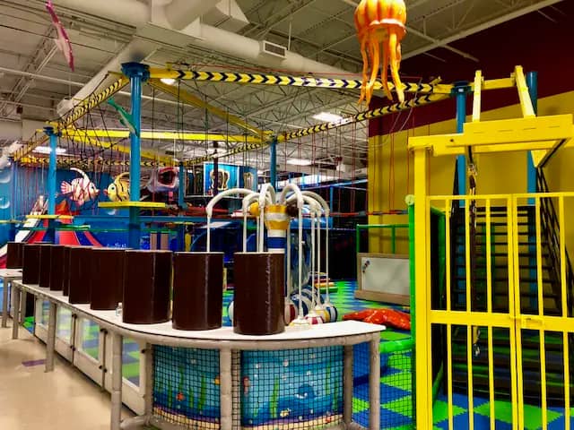 Play structure and attraction area at La La Land Boca Raton.