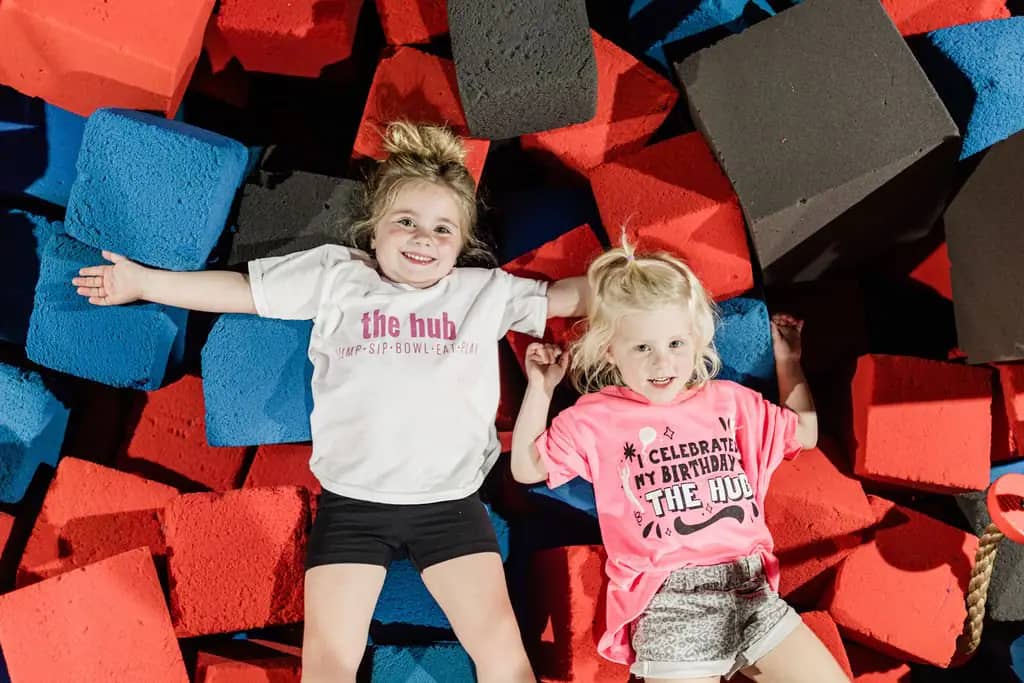 Children relaxing in the foam pit at The Hub