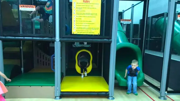 Green tube slide and yellow crawl opening inside the Hangtime Jr structure