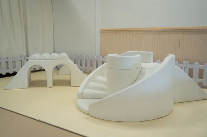 Soft-play toddler area with white climbing pieces at J&K Play Studio.