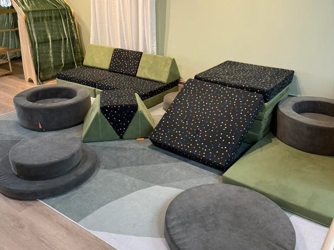 Indoor dramatic-play and activity area at Clover Exploration.