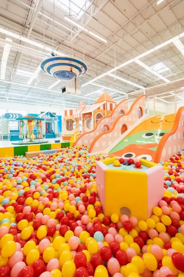 Colorful climbing and play structures inside Play City.